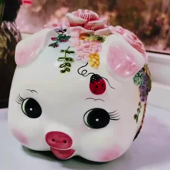 Tirelire cochon en céramique aux en relief