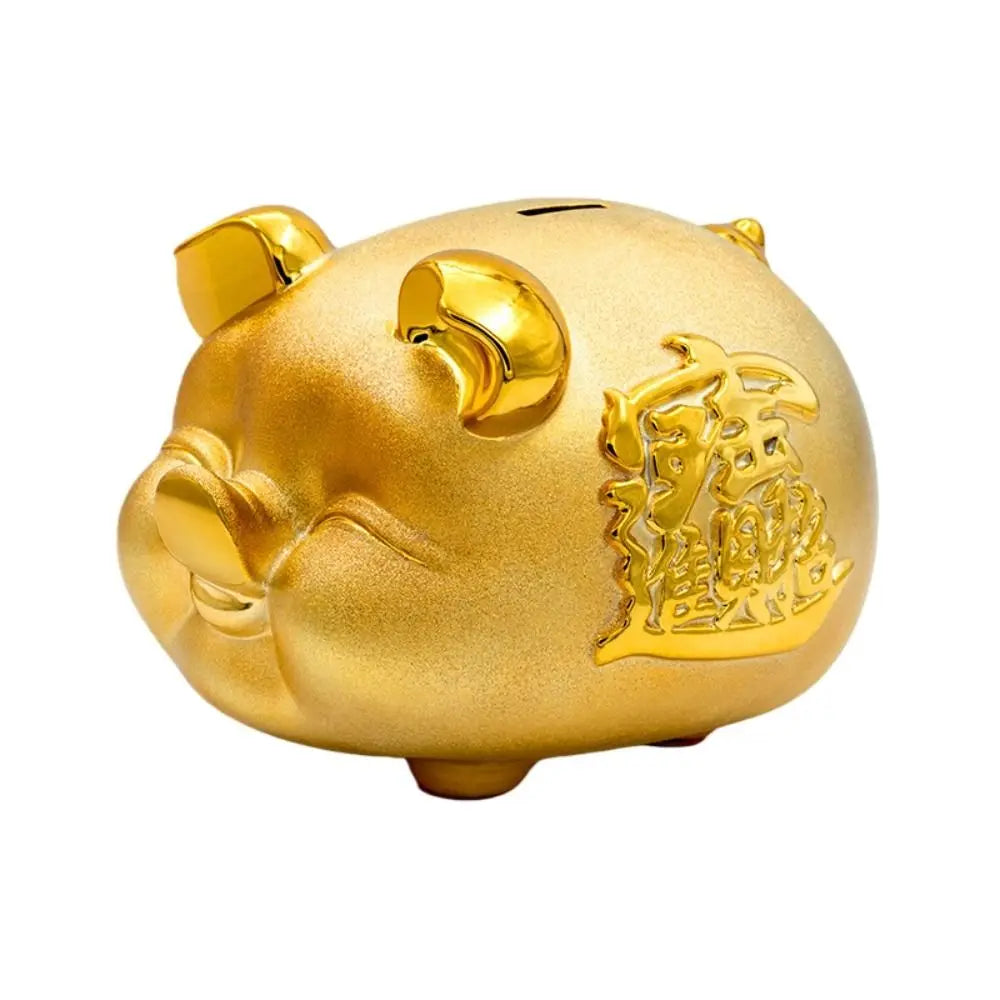 Tirelire cochon couché en or sablé et or poli, six formats