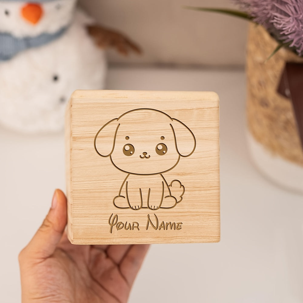 Tirelire cube en bois brut gravée d'un chiot assis