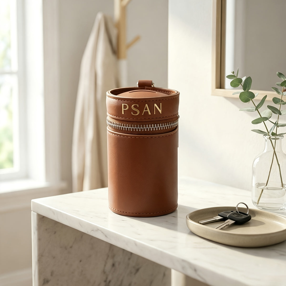 Tirelire cylindrique en simili cuir à fermeture zippée