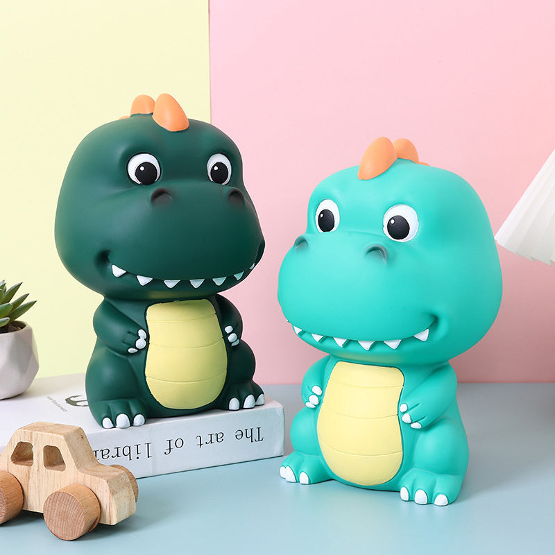 Tirelire dinosaure en PVC vert ou turquoise - 20 cm de haut