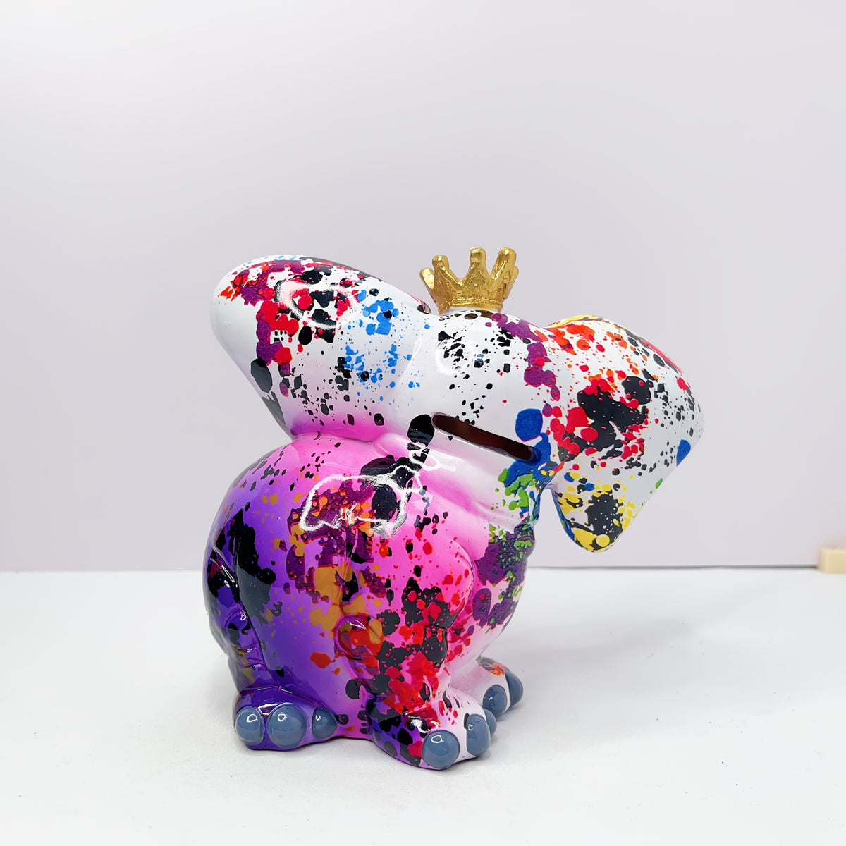 Tirelire éléphant éclaboussée de couleurs, couronne