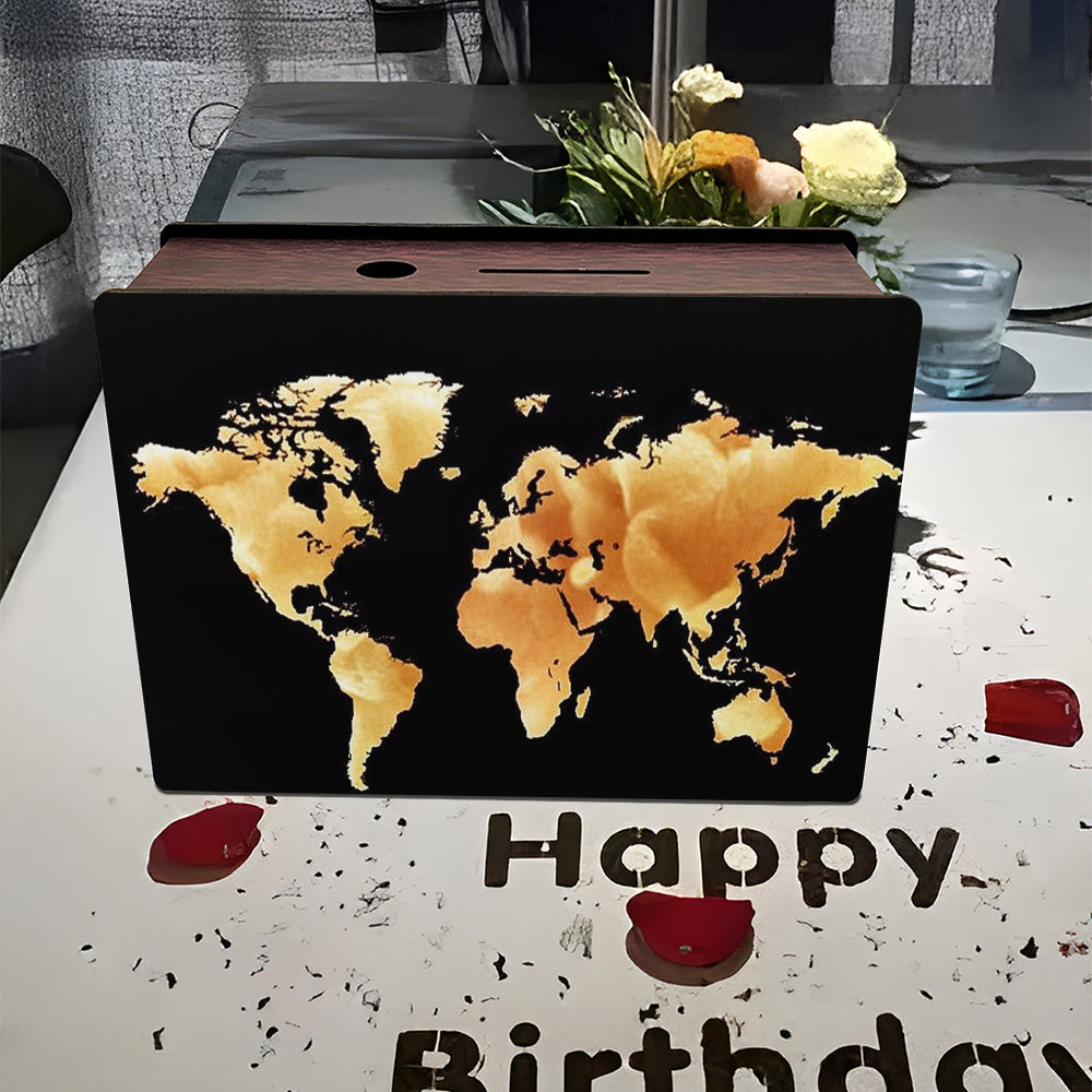 Tirelire carte du monde à 'encre sur fond uni